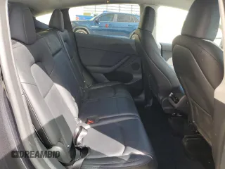 2025 Tesla Model Y Long Range with VIN 7SAYGAEEXSF253326, listed as a Copart auction lot 49527965 with 5,803 mi miles and Salvage Title. Bid and sale history available at DreamBid. Image 12.
