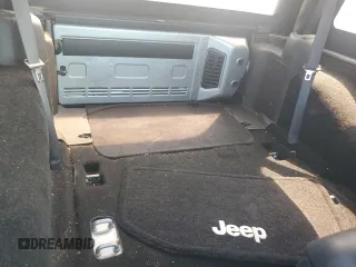 2015 Jeep Wrangler Sahara with VIN 1C4AJWBG1FL705900, listed as a Copart auction lot 62353275 with 64,866 mi miles and Salvage title. Bid and sale history available at DreamBid. Image 10.