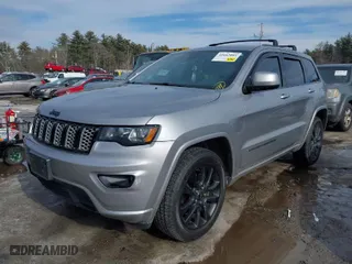 2018 Jeep Grand Cherokee Laredo E with VIN 1C4RJFAG1JC487082, listed as a IAAI auction lot 41663081 with 136,853 mi miles. Bid and sale history available at carsss.com. Image 2.
