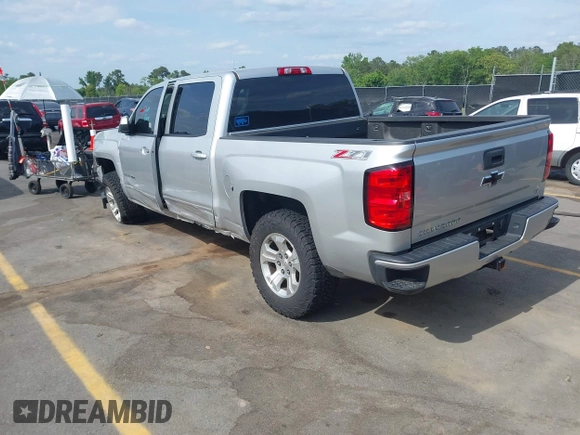 2017 Chevrolet Silverado 1500 LT with VIN 3GCUKREC5HG285689, listed as a IAAI auction lot 42055959 with 128,237 mi miles and . Bid and sale history available at DreamBid. Image 3.