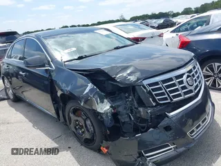 2014 Cadillac XTS Luxury with VIN 2G61M5S39E9221111, listed as a IAAI auction lot 42080819 with 94,656 mi miles and . Bid and sale history available at DreamBid. Image 1.