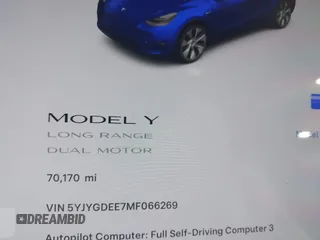 2021 Tesla Model Y Long Range with VIN 5YJYGDEE7MF066269, listed as a IAAI auction lot 42170970 with 70,170 mi miles. Bid and sale history available at carsss.com. Image 7.