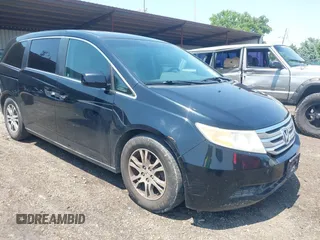 2011 Honda Odyssey EX-L with VIN 5FNRL5H65BB101057, listed as a IAAI auction lot 42468714 with 171,957 mi miles and . Bid and sale history available at DreamBid. Image 1.