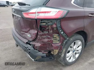 2020 Ford Edge Titanium z VIN 2FMPK4K91LBB56297, wystawiony jako IAAI lot #41938896 z przebiegiem 79 875 mil mil oraz . Historia ofert i sprzedaży dostępna na DreamBid. Obrazek 6.