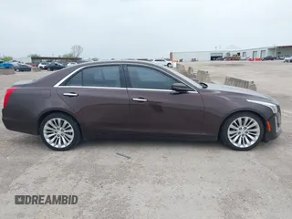 2016 Cadillac CTS Luxury Collection RWD z VIN 1G6AR5SX7G0111806, wystawiony jako IAAI lot #41908192 z przebiegiem 86 309 mil mil oraz . Historia ofert i sprzedaży dostępna na DreamBid. Obrazek 13.