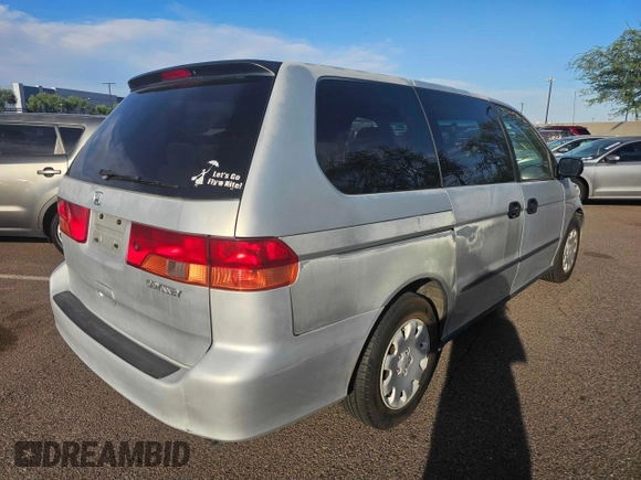 2001 Honda Odyssey LX with VIN 2HKRL18501H617598, listed as a Copart auction lot 65471805 with 125,298 mi miles and Clean title. Bid and sale history available at DreamBid. Image 3.