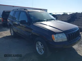 2004 Jeep Grand Cherokee with VIN 1J8GX48S24C266933, listed as a IAAI auction lot 41497122 with 200,899 mi miles and . Bid and sale history available at DreamBid. Image 1.