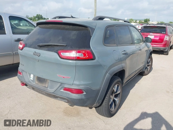 2014 Jeep Cherokee Trailhawk z VIN 1C4PJMBS2EW161276, wystawiony jako IAAI lot #42283358 z przebiegiem 135 201 mil mil oraz . Historia ofert i sprzedaży dostępna na DreamBid. Obrazek 4.
