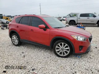 2014 Mazda CX-5 Grand Touring with VIN JM3KE2DY1E0332971, listed as a Copart auction lot 51235415 with 105,338 mi miles and Salvage Title. Bid and sale history available at carsss.com. Image 4.