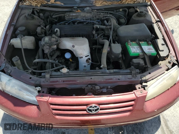 1999 Toyota Camry LE z VIN JT2BG22K6X0274398, wystawiony jako Copart lot #57263795 z przebiegiem 202 944 mil mil oraz Szkoda całkowita • Salvage title. Historia ofert i sprzedaży dostępna na DreamBid. Obrazek 11.
