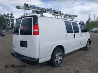 2013 Chevrolet Express Cargo Van with VIN 1GCSGAFX0D1111985, listed as a IAAI auction lot 42065556 with 243,671 mi miles. Bid and sale history available at carsss.com. Image 4.