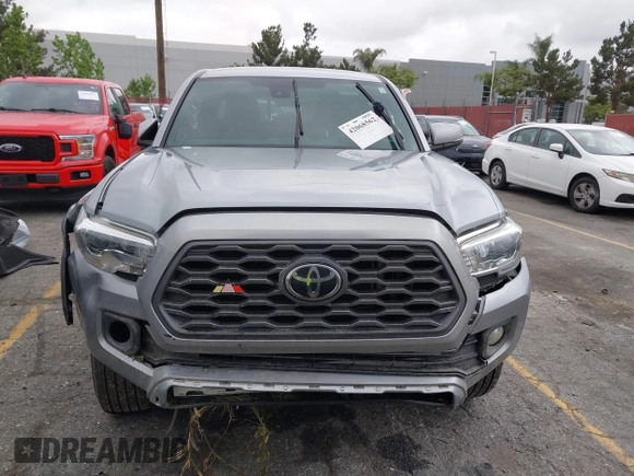 2021 Toyota Tacoma SR z VIN 3TMCZ5AN3MM374132, wystawiony jako IAAI lot #42068562 z przebiegiem 38 654 mil mil oraz . Historia ofert i sprzedaży dostępna na DreamBid. Obrazek 13.