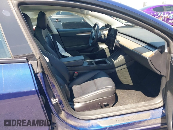 2023 Tesla Model 3 with VIN 5YJ3E1EA1PF431190, listed as a IAAI auction lot 41980007 with 26,164 mi miles and . Bid and sale history available at DreamBid. Image 5.
