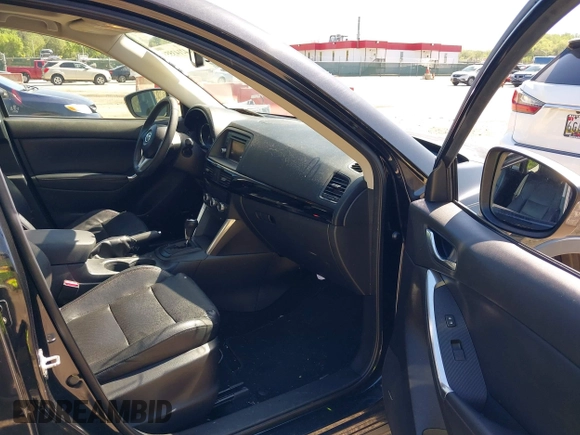 2013 Mazda CX-5 Grand Touring with VIN JM3KE4DE6D0127601, listed as a IAAI auction lot 42143558 with 95,719 mi miles and . Bid and sale history available at DreamBid. Image 5.