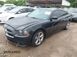 2014 Dodge Charger RT with VIN 2C3CDXCT4EH340887, listed as a IAAI auction lot 42113933 with 143,897 mi miles. Bid and sale history available at carsss.com. Image 2.