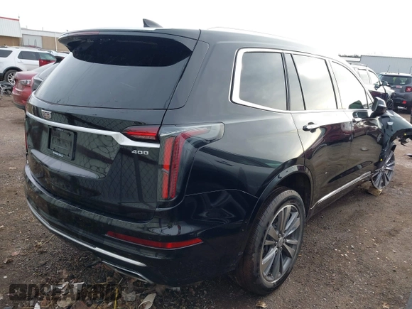 2021 Cadillac XT6 Premium Luxury z VIN 1GYKPDRS9MZ120150, wystawiony jako IAAI lot #41715368 z przebiegiem 47 835 mil mil oraz . Historia ofert i sprzedaży dostępna na DreamBid. Obrazek 4.