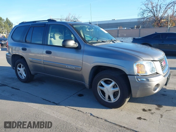 2005 GMC Envoy SLT with VIN 1GKDT13S152373799, listed as a IAAI auction lot 41537512 with 187,750 mi miles. Bid and sale history available at carsss.com. Image 1.