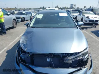 2024 Toyota Corolla Hybrid LE with VIN JTDBCMFE5RJ030239, listed as a IAAI auction lot 40489207 with 5,295 mi miles. Bid and sale history available at carsss.com. Image 13.