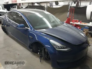 2019 Tesla Model 3 Mid Range with VIN 5YJ3E1EA8KF311623, listed as a IAAI auction lot 41835206 with 68,876 mi miles and . Bid and sale history available at carsss.com. Image 1.