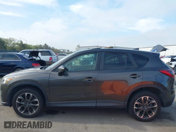 2016 Mazda CX-5 Grand Touring z VIN JM3KE4DY2G0684066, wystawiony jako IAAI lot #42078725 z przebiegiem 200 129 mil mil oraz . Historia ofert i sprzedaży dostępna na DreamBid. Obrazek 14.