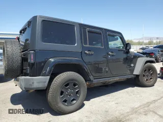 2015 Jeep Wrangler Unlimited Freedom with VIN 1C4HJWDG0FL598947, listed as a Copart auction lot 61794214 with 125,778 mi miles and Salvage title. Bid and sale history available at DreamBid. Image 3.