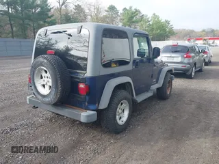 2005 Jeep Wrangler Sport with VIN 1J4FA49S25P302627, listed as a IAAI auction lot 42100601 with 169,650 mi miles. Bid and sale history available at carsss.com. Image 4.