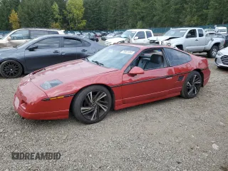1987 Pontiac Fiero GT z VIN 1G2PG1199HP214795, wystawiony jako Copart lot #75901054 z przebiegiem 206 675 mil mil oraz Szkody całkowita. Historia ofert i sprzedaży dostępna na DreamBid. Obrazek 1.