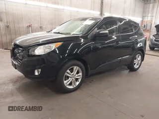 2013 Hyundai Tucson GLS with VIN KM8JU3AC8DU557445, listed as a IAAI auction lot 41839782 with 153,769 mi miles. Bid and sale history available at carsss.com. Image 2.