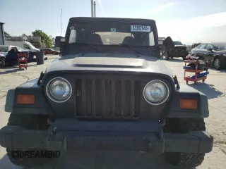 1998 Jeep Wrangler Sport with VIN 1J4FY19S1WP757593, listed as a Copart auction lot 52382945 with 230,086 mi miles and Salvage Title. Bid and sale history available at carsss.com. Image 5.
