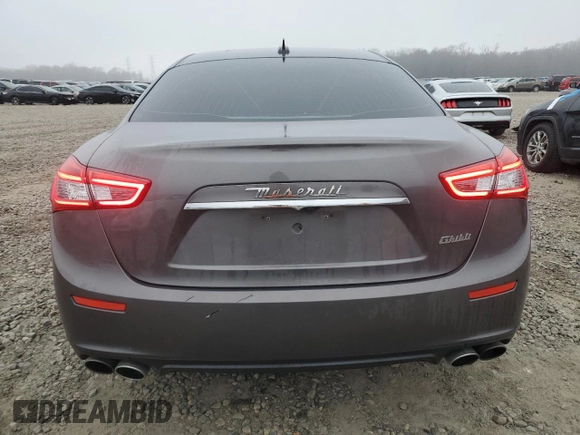 2016 Maserati Ghibli z VIN ZAM57XSA7G1168458, wystawiony jako Copart lot #43611465 z przebiegiem 98 110 mil mil oraz Szkody całkowita. Historia ofert i sprzedaży dostępna na DreamBid. Obrazek 6.