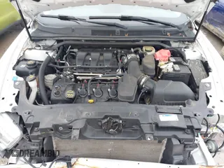 2015 Ford Taurus Limited with VIN 1FAHP2F85FG117635, listed as a IAAI auction lot 41979311 with 104,314 mi miles. Bid and sale history available at carsss.com. Image 10.