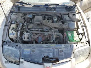 2002 Pontiac Sunfire SE z VIN 1G2JB124327288986, wystawiony jako Copart lot #64072634 z przebiegiem 122 306 mil mil oraz Szkody całkowita. Historia ofert i sprzedaży dostępna na DreamBid. Obrazek 11.