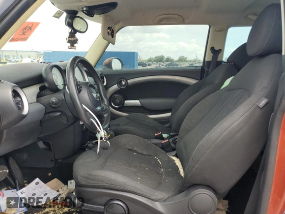 2011 MINI Hardtop with VIN WMWSU3C52BT094399, listed as a Copart auction lot 56561635 with 94,428 mi miles and Salvage Title. Bid and sale history available at DreamBid. Image 7.