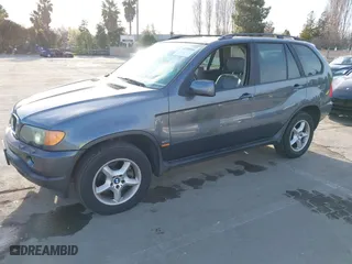 2003 BMW X5 3.0i with VIN 5UXFA53573LV83812, listed as a IAAI auction lot 41590046 with 166,841 mi miles. Bid and sale history available at carsss.com. Image 2.