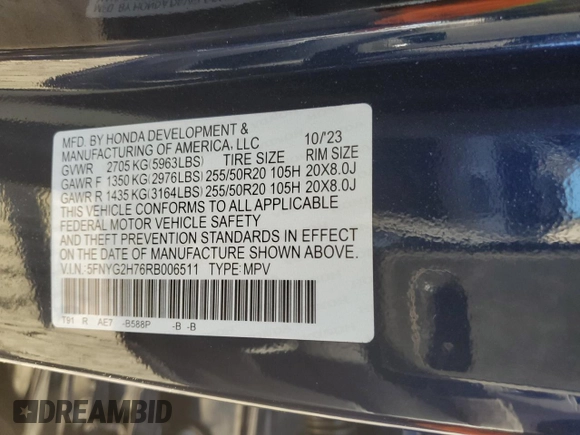 2024 Honda Pilot Touring z VIN 5FNYG2H76RB006511, wystawiony jako Copart lot #80920634 z przebiegiem 19 333 mil mil oraz Szkoda całkowita • Salvage title. Historia ofert i sprzedaży dostępna na DreamBid. Obrazek 13.