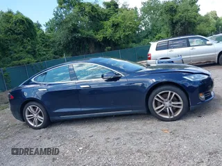 2013 Tesla Model S with VIN 5YJSA1CN0DFP21851, listed as a IAAI auction lot 42557791 with 106,328 mi miles and . Bid and sale history available at DreamBid. Image 14.