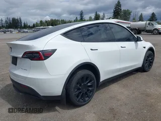 2022 Tesla Model Y Long Range z VIN 7SAYGDEE9NF494901, wystawiony jako IAAI lot #42310520 z przebiegiem 62 515 mil mil oraz . Historia ofert i sprzedaży dostępna na DreamBid. Obrazek 4.