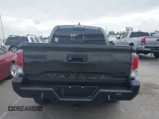2021 Toyota Tacoma SR z VIN 3TMCZ5AN9MM397611, wystawiony jako IAAI lot #41467705 z przebiegiem 65 191 mil mil oraz . Historia ofert i sprzedaży dostępna na DreamBid. Obrazek 16.