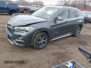 2017 BMW X1 xDrive28i with VIN WBXHT3C35H5F74213, listed as a IAAI auction lot 41589180 with 58,990 mi miles. Bid and sale history available at carsss.com. Image 2.