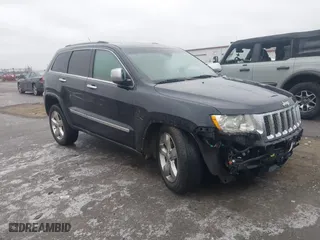 2012 Jeep Grand Cherokee Overland with VIN 1C4RJFCT9CC182216, listed as a IAAI auction lot 41490446 with 153,237 mi miles. Bid and sale history available at carsss.com. Image 1.