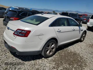 2015 Ford Taurus SEL z VIN 1FAHP2E8XFG181929, wystawiony jako Copart lot #64022325 z przebiegiem 106 272 mil mil oraz Szkoda całkowita • Salvage title. Historia ofert i sprzedaży dostępna na DreamBid. Obrazek 3.