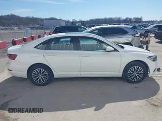 2021 Volkswagen Jetta S z VIN 3VWC57BU0MM070993, wystawiony jako IAAI lot #41650935 z przebiegiem 58 683 mil mil oraz . Historia ofert i sprzedaży dostępna na DreamBid. Obrazek 14.