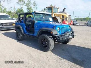 2015 Jeep Wrangler Sport z VIN 1C4AJWAG8FL550859, wystawiony jako IAAI lot #42154946 z przebiegiem 143 658 mil mil oraz . Historia ofert i sprzedaży dostępna na DreamBid. Obrazek 1.