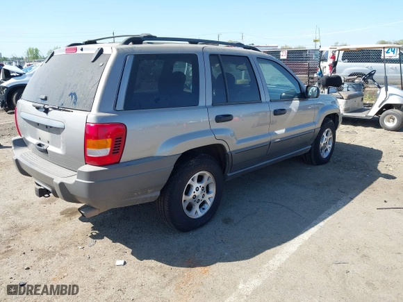 2001 Jeep Grand Cherokee Laredo with VIN 1J4GW48S61C662315, listed as a IAAI auction lot 42002235 with 166,901 mi miles. Bid and sale history available at carsss.com. Image 4.