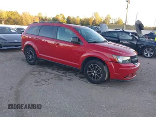 2017 Dodge Journey SE z VIN 3C4PDCAB7HT677064, wystawiony jako IAAI lot #40909758 z przebiegiem 135 621 mil mil oraz . Historia ofert i sprzedaży dostępna na DreamBid. Obrazek 1.