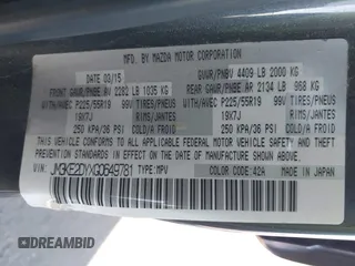 2016 Mazda CX-5 Grand Touring z VIN JM3KE2DYXG0649781, wystawiony jako IAAI lot #41636329 z przebiegiem 83 433 mil mil oraz . Historia ofert i sprzedaży dostępna na DreamBid. Obrazek 9.