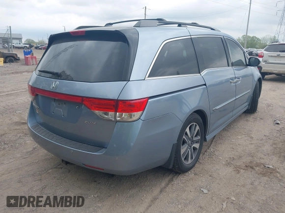 2014 Honda Odyssey Touring with VIN 5FNRL5H91EB081811, listed as a IAAI auction lot 42153920 with 16 mi miles and . Bid and sale history available at DreamBid. Image 4.