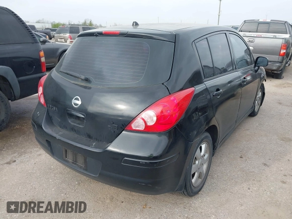 2009 Nissan Versa 1.8 SL with VIN 3N1BC13E59L496882, listed as a IAAI auction lot 41798734 with 210,907 mi miles. Bid and sale history available at carsss.com. Image 4.