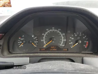 1999 Mercedes-Benz E-Class with VIN WDBJF65H3XA882627, listed as a Copart auction lot 72476674 with 187,656 mi miles and Salvage Title. Bid and sale history available at carsss.com. Image 9.