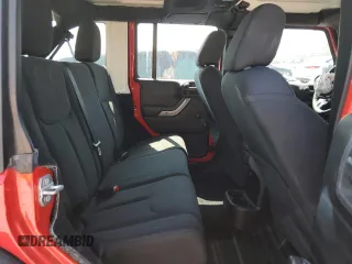 2015 Jeep Wrangler Unlimited Willys Wheeler with VIN 1C4BJWDG3FL726460, listed as a Copart auction lot 55827355 with 96,482 mi miles and Salvage Title. Bid and sale history available at DreamBid. Image 11.